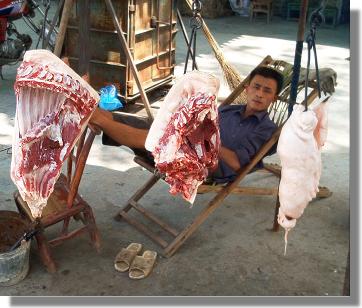 Road side meat seller in China.