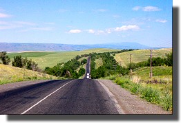 A good road with rolling hills about 100km north of Almaty.