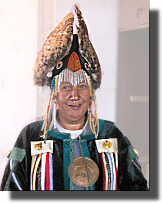 A female Shaman with dead owl.